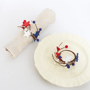 Detail of USA Independence Day napkin ring with red white blue stars on ceramic plate