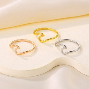 Minimalist wave shaped titanium steel rings in gold, rose gold and silver colors