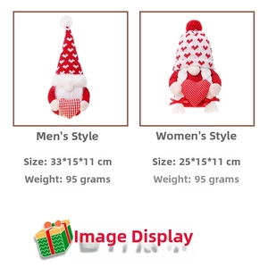 Detail of male and female Christmas gnome plush dolls with heart patterns for holiday decor