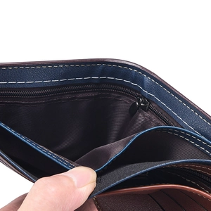 Detail view of bi-fold wallet featuring a zipper coin pocket and card slots with contrast stitching