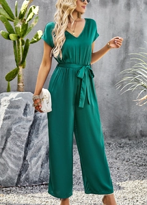 Detailed texture of green satin fabric on V-neck short sleeve jumpsuits for women