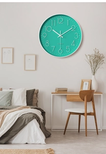 Detail of 30cm mint green silent quartz wall clock with 3D numbers in modern bedroom
