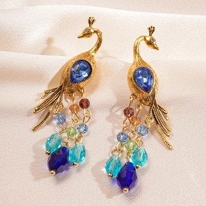 Vintage gold peacock earrings with blue crystal and colorful beaded tassels on silk