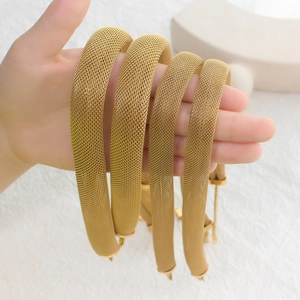 Chic gold mesh choker and bracelet set made of stylish titanium steel shown in hand
