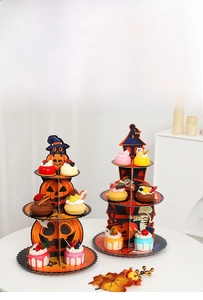 Three-tier Halloween cupcake stand featuring pumpkin, castle, and mummy cardboard motifs
