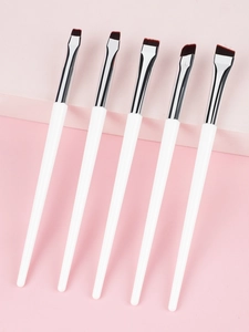 Detailed set of 5 angled eyeliner and eyebrow brushes with white handles and silver ferrules
