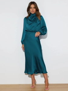 Detailed view of dark cyan satin dress showing elegant high neck and draped fabric texture