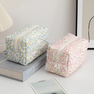 Quilted cotton floral makeup bags in blue and pink, spacious travel cosmetic organizers