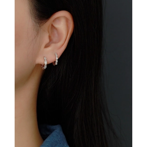 Close-up of elegant S925 sterling silver geometric hoop earrings with sparkling crystals