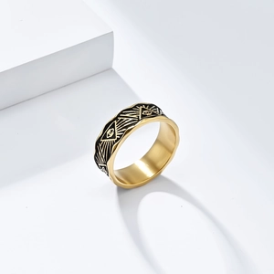 Macro detail of Eye of Providence gold ring with black enamel and wavy edges
