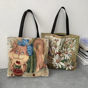 Artistic jacquard tote bags with cat and daisy prints featuring black durable handles
