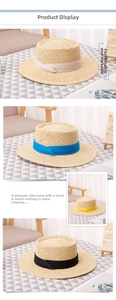 Detail of handmade boater hats with colorful ribbons in beige, blue, yellow and black
