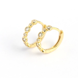 Elegant gold S925 silver hoop earrings featuring sparkling inlaid cubic zirconia stones