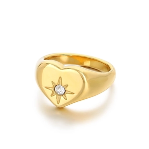 Polished gold heart signet ring with sparkling starburst zircon at a 45-degree angle