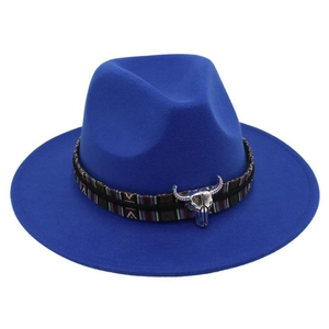 Detail of royal blue felt hat featuring ethnic woven band and silver bull skull pendant