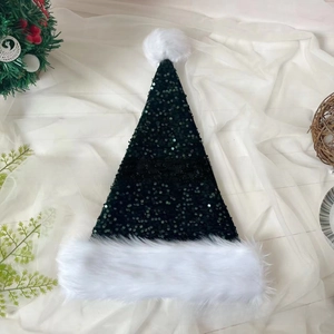 Detail of dark green sequin Christmas hat with fluffy white plush brim and pompom decoration
