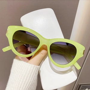 Fluorescent green cat eye sunglasses with dark gradient lenses for fashion street style