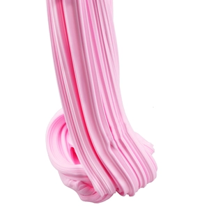 Macro shot showing the stretchy texture of pink cotton butter slime on white background