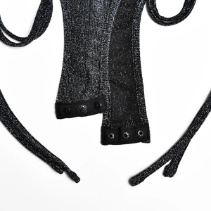 Detail showing the snap-button closure on black glitter fabric with silver sparkle