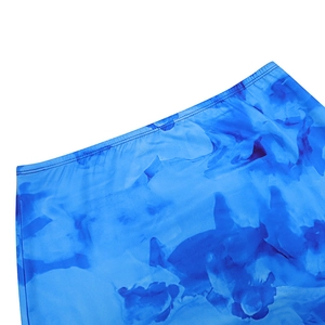 Detail shot of blue tie-dye printed skirt showing the elastic waistband and fine stitching