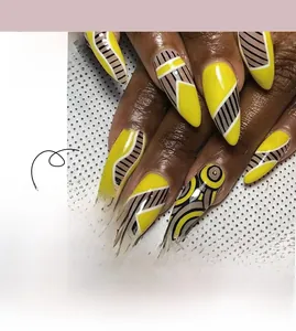 Detail of yellow almond press-on nails with hand-painted black and brown geometric patterns