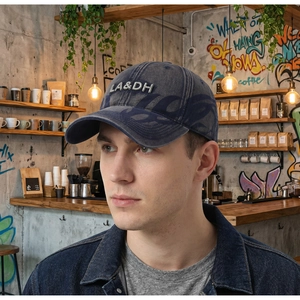Close-up of vintage washed denim baseball cap with 3D embroidery and side flame pattern