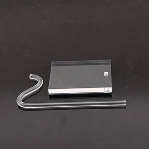 Detailed view of clear acrylic display base and J-shaped stand for watches and jewelry