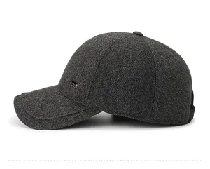 Side view of dark grey men's baseball cap in thick wool fabric with metal side buckle detail