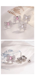 Detailed view of silver butterfly stud earrings with pink and clear zircon stones
