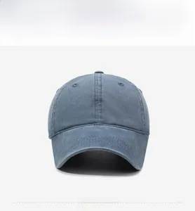 Front view of washed cotton baseball cap in navy blue with reinforced stitched brim
