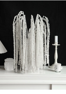 Close-up of elegant white pearl bead spray on a branch for Christmas wreath decoration