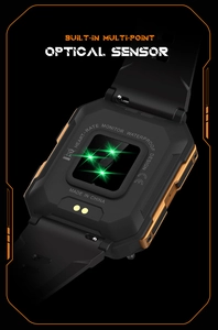 Macro detail of the smart watch back featuring optical heart rate sensor and charging pins