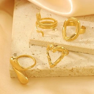 Vintage style gold stainless steel ring set with hollow carved patterns on stone surface