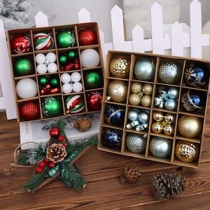 Christmas ball ornament set with red and white festive patterns on a dark wooden table