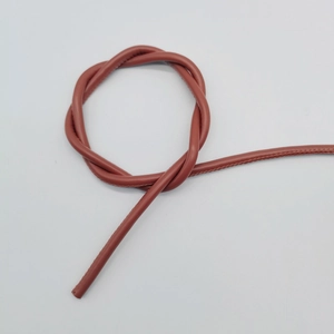 Close-up of 6mm reddish brown round leather cord with stitched seam detail and texture