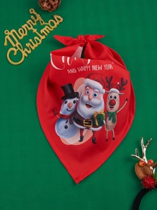 Detail of red Christmas pet bandana featuring Santa and reindeer on green background