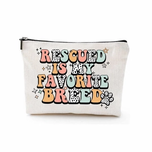 White canvas makeup bag featuring Rescued is My Favorite Breed vintage slogan print