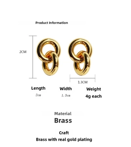 Detail view of interlocking gold-plated brass double ring earrings with dimensions