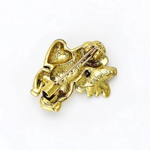 Retro golden winged lion brooch back view with secure metal pin clasp on white background