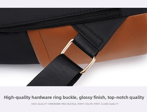 Detail of high-quality golden hardware buckle and brown leather on black fabric backpack