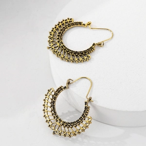 Vintage hollow carved earrings in gold finish with geometric fan shape and ethnic style