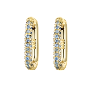Detailed macro view of S925 sterling silver stamp on gold hoop earrings with blue stones