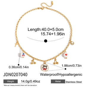 Detailed view of 18K gold plated stainless steel necklace with cherry and heart charms