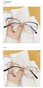 Detail of elegant cat-eye metal glasses frames in black-gold and full-gold finishes