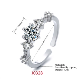 Detailed close-up of open ring showing polished copper band and five sparkling zircons