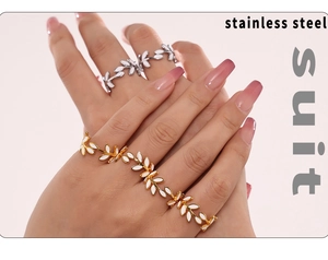 Close-up of leaf pattern ring and bracelet set in 18k gold plated stainless steel