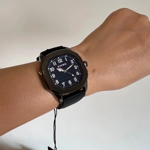 Men's large square face watch with VIKEC logo and black silicone strap on wrist