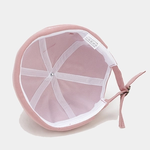 Pink cotton docker cap with internal white tape reinforcement and adjustable metal buckle