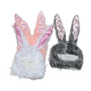 Detail of plush bunny ear hats in white, pink and gray featuring satin inner ear lining