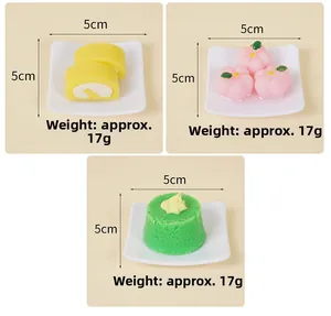 Detailed view of three miniature cake models on square plates, weight approx 17g, 5cm size